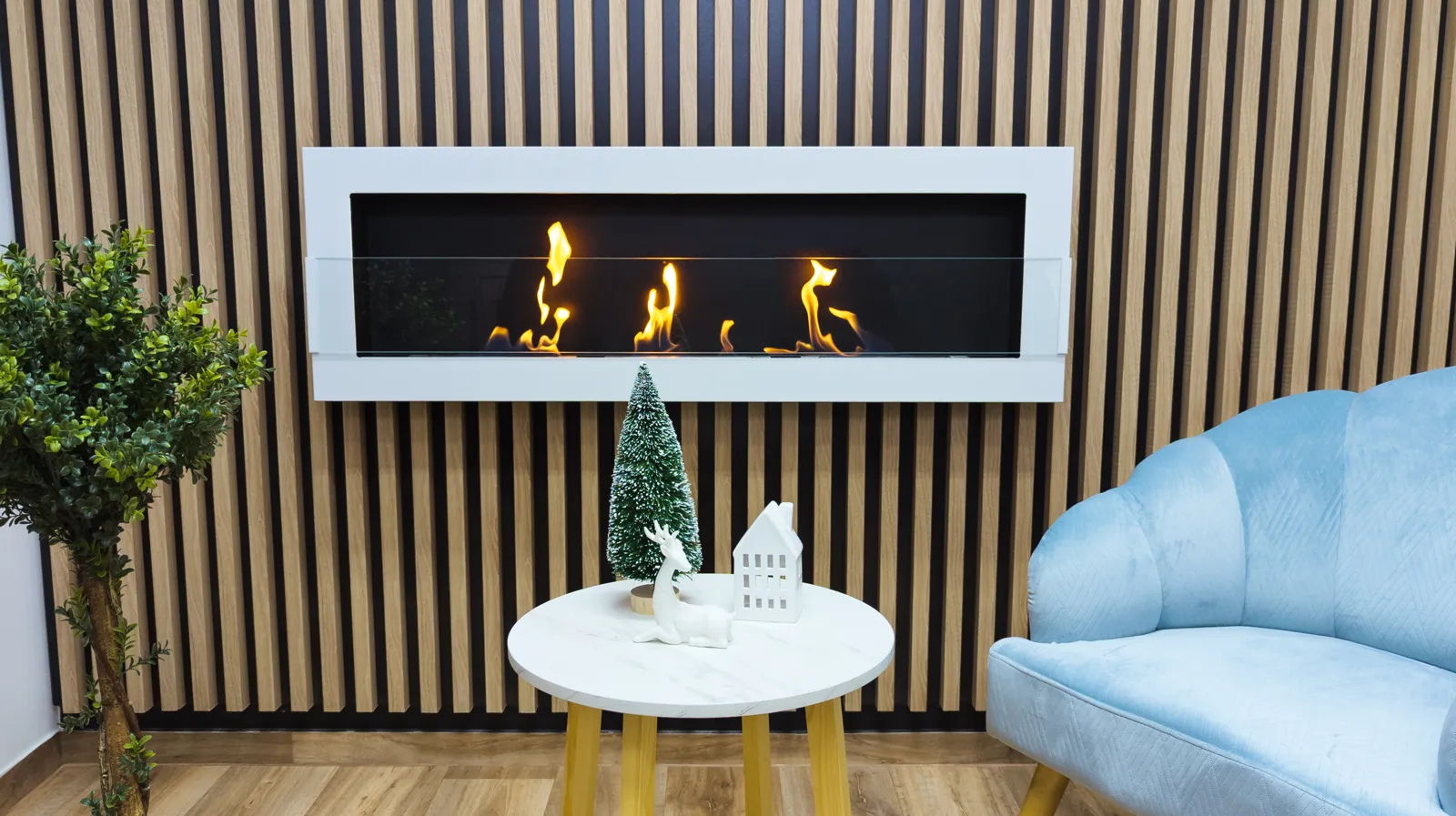 Wide white bioethanol fireplace in a living room with wooden slats