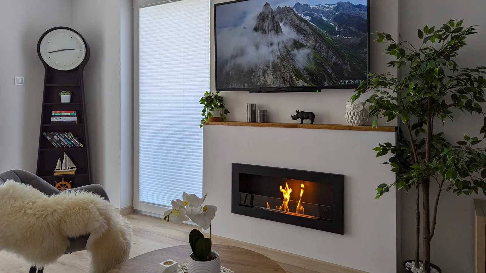 Black slim bioethanol fireplace on a living room wall