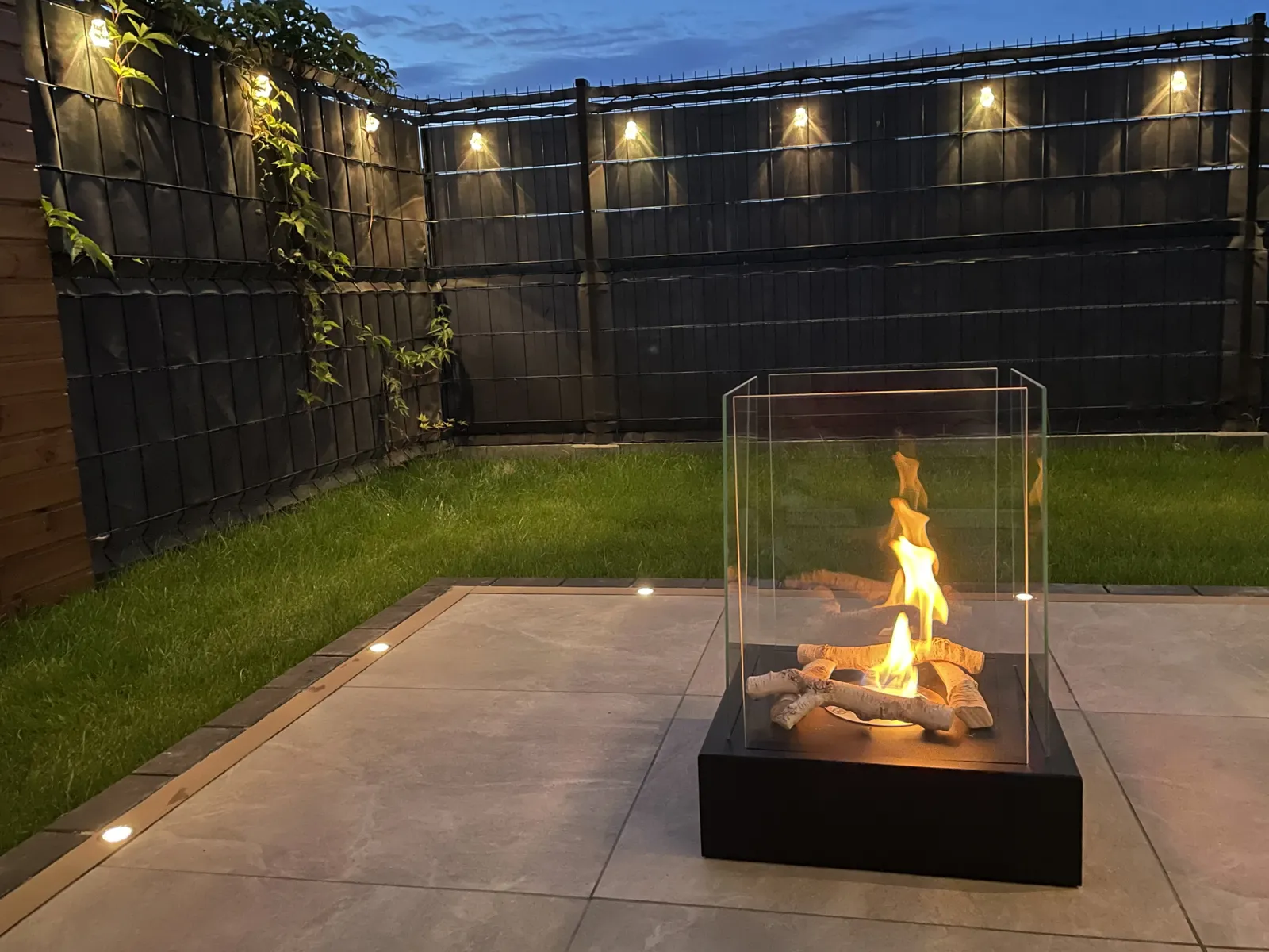 Sunset Garden Bioethanol Fireplace – Black in a home setting