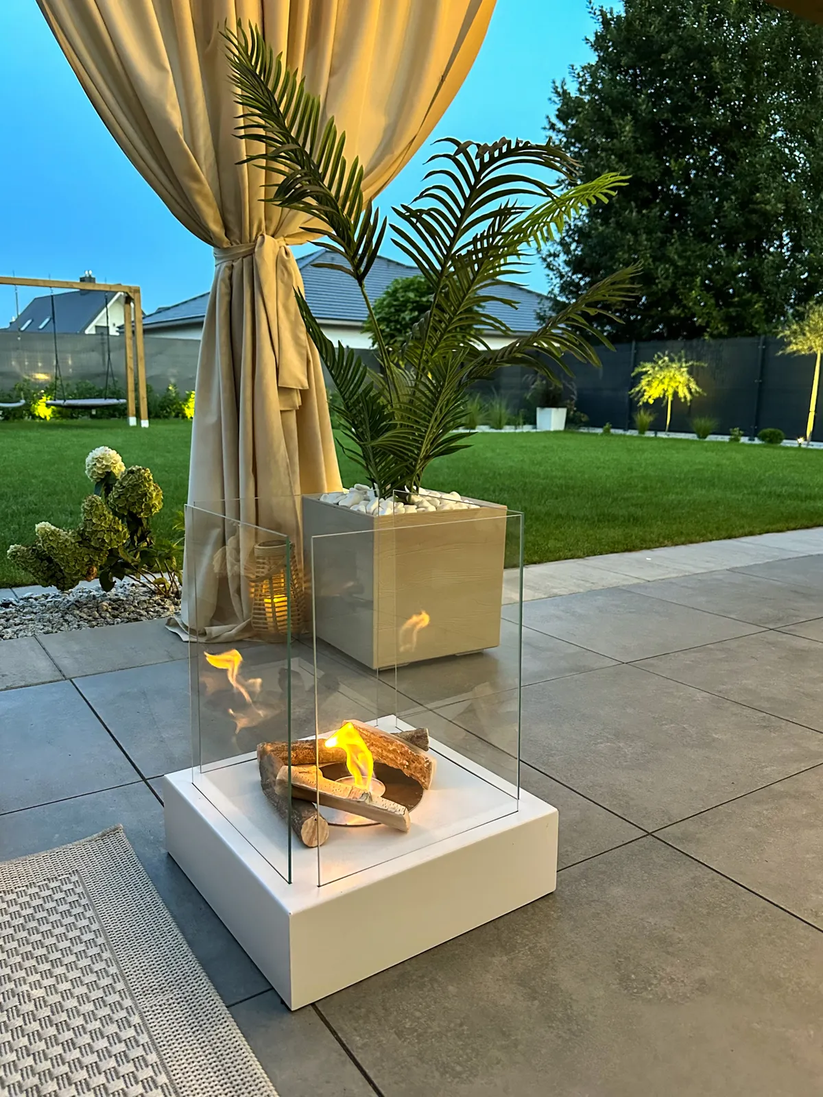 Sunset Garden Bioethanol Fireplace – White in a home setting